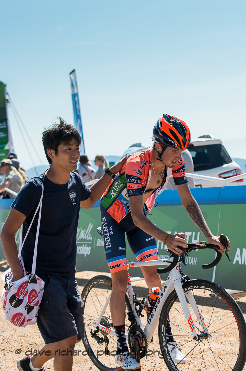 Nippo-Vini Fantini-Faizane soigneur tends to his exhausted rider at the finish of Stage 2 - Brigham City to Powder Mountain Resort, 2019 LHM Tour of Utah (Photo by Dave Richards, daverphoto.com)