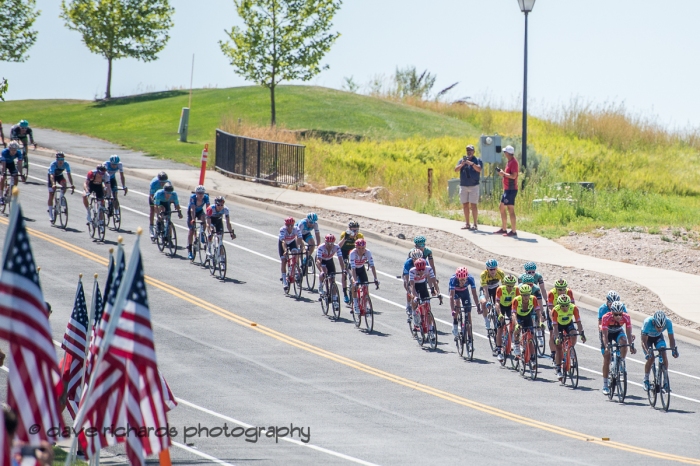 The peloton is chasing the break on the final circuits of Stage 3 - Antelope Island State Park to North Salt Lake City, 2019 LHM Tour of Utah (Photo by Dave Richards, daverphoto.com)
