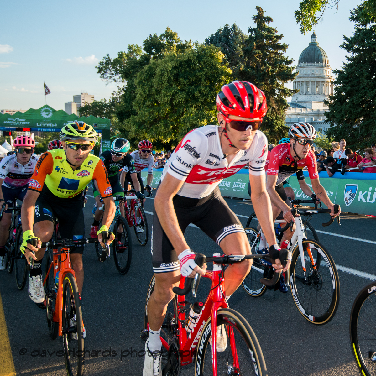 The peloton rolls through the start/finish line during one of the circuits on Stage 4 - Salt Lake City Circuit Race, 2019 LHM Tour of Utah (Photo by Dave Richards, daverphoto.com)