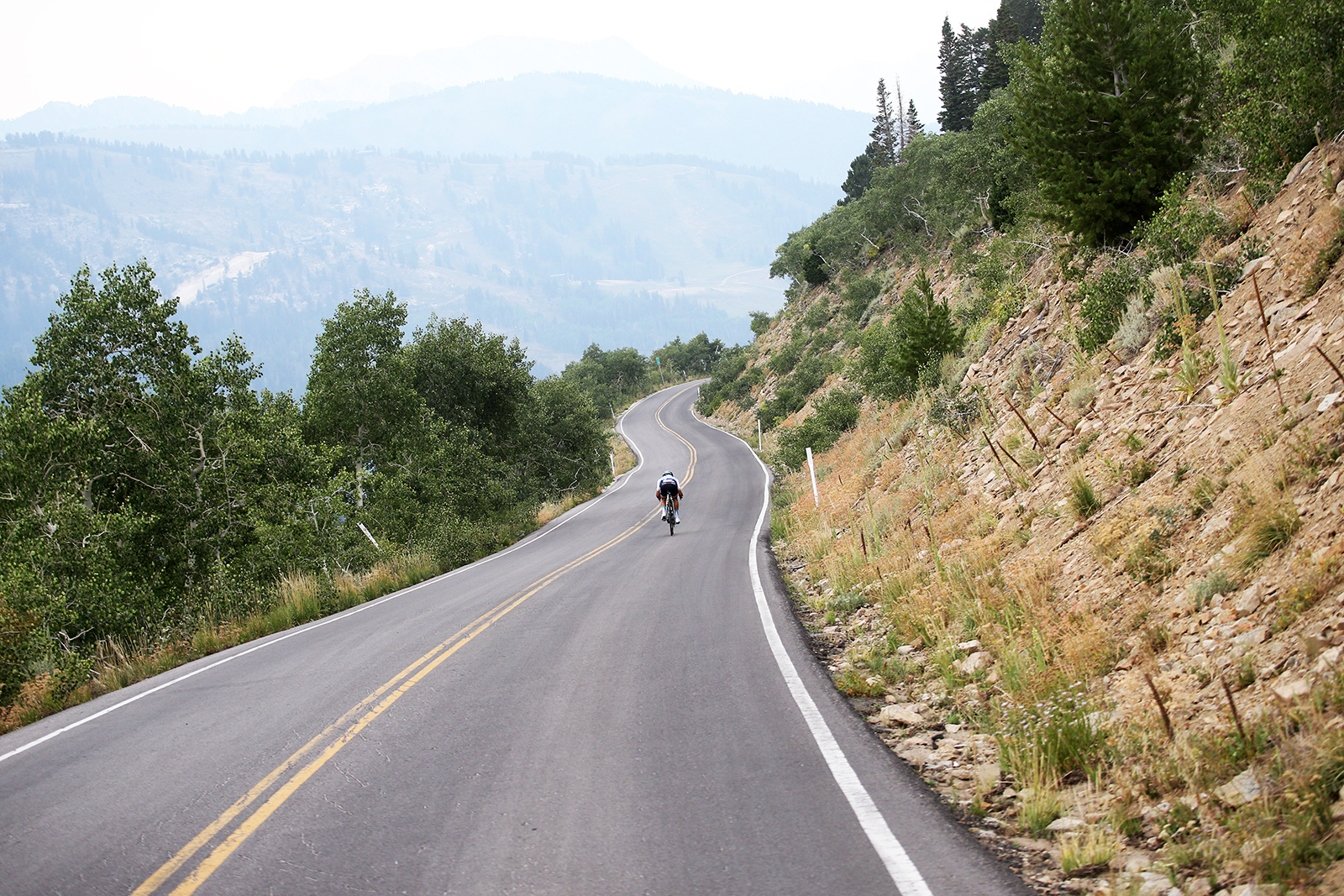 A rider descends Guardsman Pass. Stage 5 of the 2018 Tour of Utah, August 10, 2018. Photo by Cathy Fegan-Kim, www.cottonsoxphotography.net