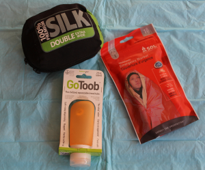 Sea to Summit silk sleeping bag liner, SOL emergency blanket, and