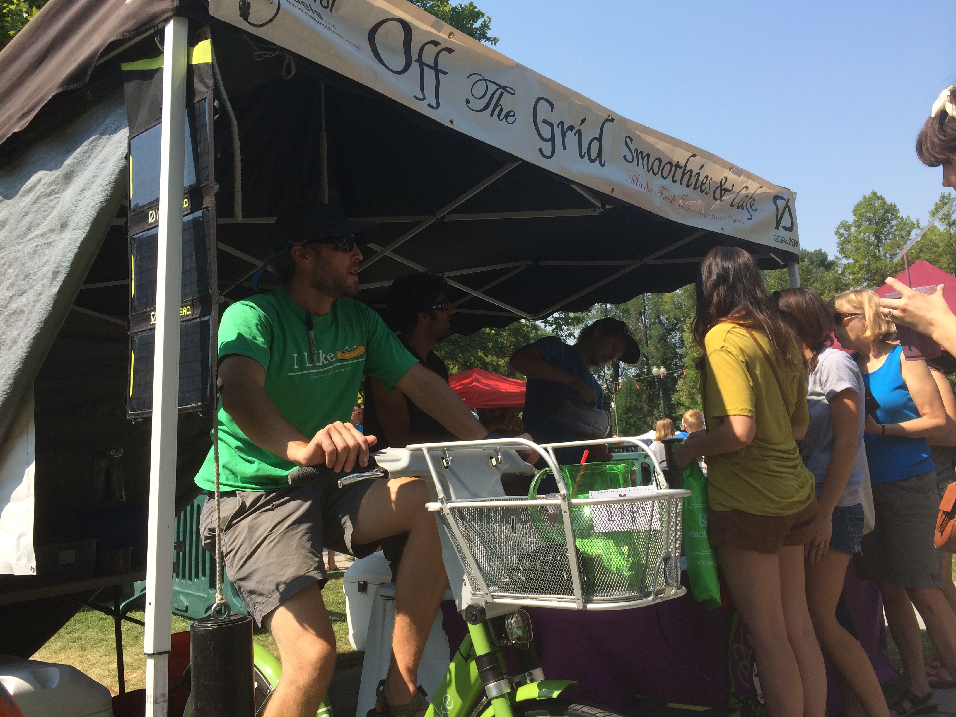 Off the Grid uses a Greenbike to power a blender at the Salt Lake City Farmer's Market on July 19, 2014. They make healthy, high quality smoothies. Photo by Dave Iltis