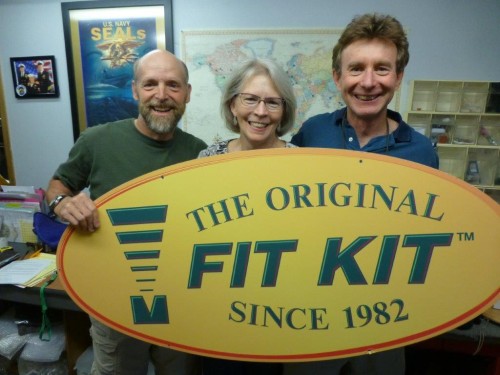 Chris Nurre and Gayle Nurre, owners of Fit Kit Systems for 20 years passing the banner to John Higgins.