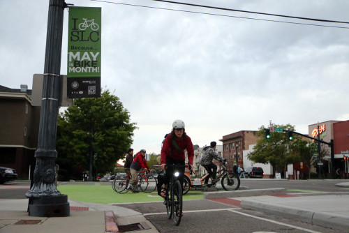 Heidi Goedhart, UDOT's new Bicycle and Pedestrian Coordinator, rides through Salt Lake City's trend setting protected intersection at 300 S. and 200 W. The Bike Month banners will be up throughout May to celebrate the bicycle!