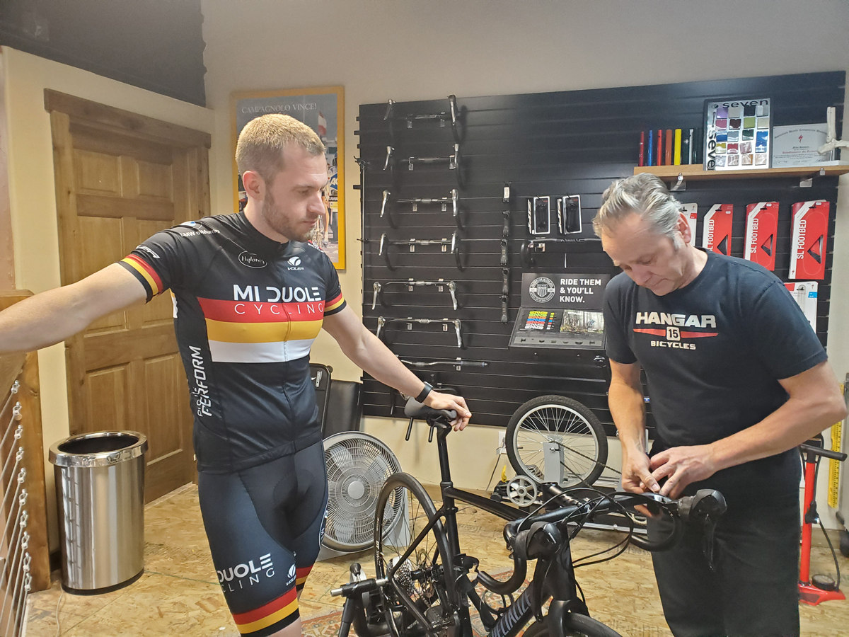 Mike Hanseen adjusts Graydon Braithwaite's (Mi Duole Cycling Team) bike fit. Photo by Anthony Nocella II