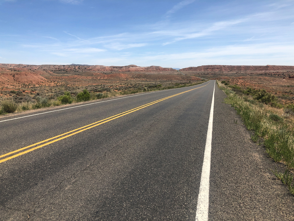 Typical highway and shoulder north of Vernal, Utah. Uintas Bike Tour scenes.